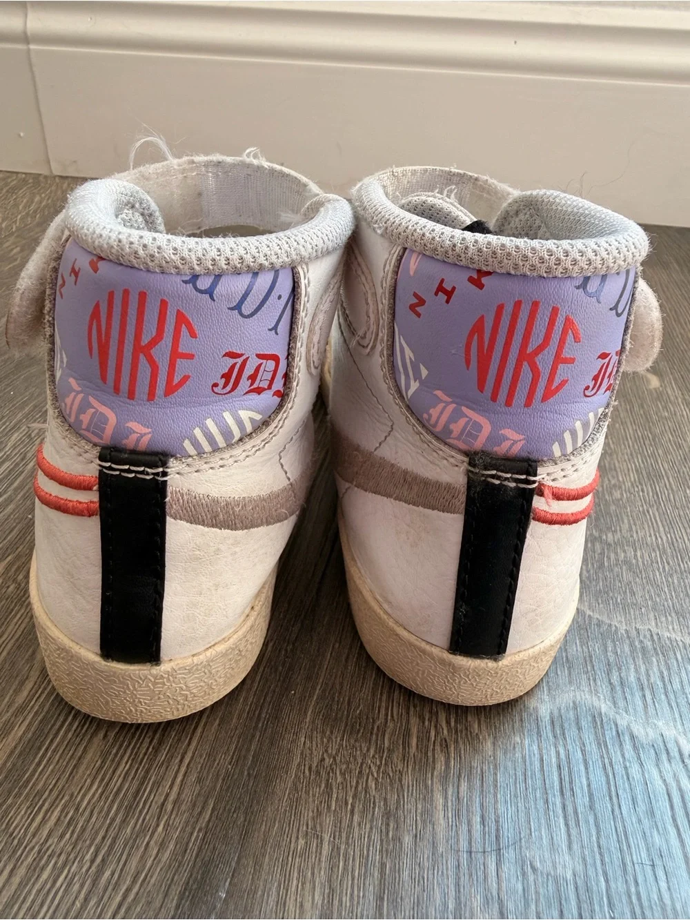 Nike Kids White High-Top Sneakers with Coral Swoosh Accent